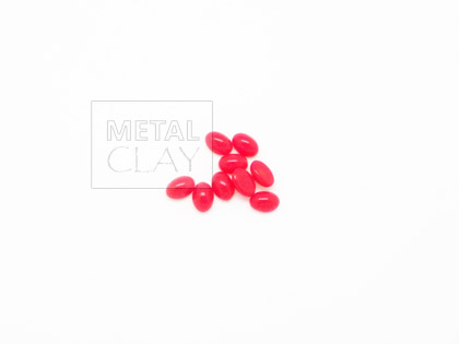 Szklany owalny kaboszon czerwony 5x7mm