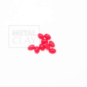 Szklany owalny kaboszon czerwony 5x7mm